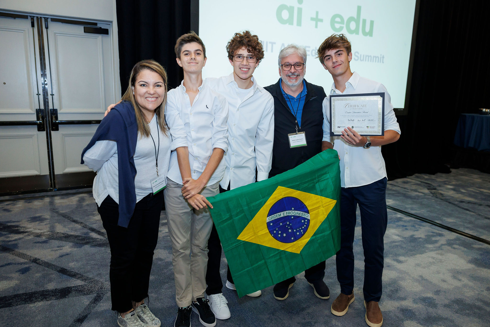 Winning team from 2024 Global AI Hackathon poses with the Brazilian flag